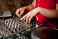 The DJ`s hand on the DJ mixer. Dj on the turntables. DJ`s hand on a DJ mixer close-up