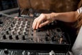 The DJ`s hand on the DJ mixer. Dj on the turntables. DJ`s hand on a DJ mixer close-up