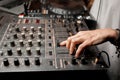 The DJ`s hand on the DJ mixer. Dj on the turntables. DJ`s hand on a DJ mixer close-up