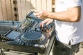 DJ`s hands mix music on the mixer close-up Royalty Free Stock Photo