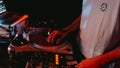 DJ scratching vinyl record on turntable, close-up