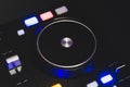 Dj sound mixer controller with knobs and sliders. audio mixing deck with turntables at dark with illuminated controls Royalty Free Stock Photo