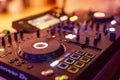 DJ Spinning, Mixing, and Scratching in a Night Club. DJ playing music at mixer . Closeup. Party. Royalty Free Stock Photo