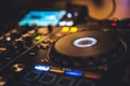 DJ Spinning, Mixing, and Scratching in a Night Club. DJ playing music at mixer . Closeup. Party. Royalty Free Stock Photo