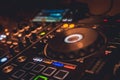 DJ Spinning, Mixing, and Scratching in a Night Club. DJ playing music at mixer . Closeup. Party. Royalty Free Stock Photo