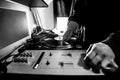 Dj in studio with turntable and mixer Royalty Free Stock Photo
