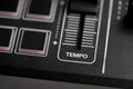 DJ tempo fader on Digital DJ controller closed up shot