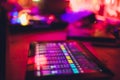 DJ turntable console mixer controlling with two hand in concert nightclub stage. selective focus Royalty Free Stock Photo