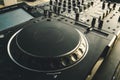 DJ turntable deck mixer close up, sound equipment, audio control panel for party, night clubs or music studio Royalty Free Stock Photo