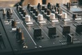 DJ turntable deck mixer close up, sound equipment, audio control panel for party, night clubs or music studio Royalty Free Stock Photo