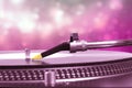 Dj turntable with pink bokeh background Royalty Free Stock Photo