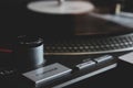 Dj turntable turntable playing vinyl disc with hip hop music.Closeup, focus on needle cartridge headshell. Royalty Free Stock Photo