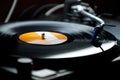 Dj turntables needle cartridge on black vinyl record with music. Close up, focus on turntable and audio disc record Royalty Free Stock Photo