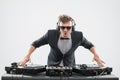 DJ in tuxedo mixing by turntable Royalty Free Stock Photo