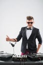 DJ in tuxedo showing his thumb up standing by Royalty Free Stock Photo