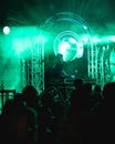 DJ at Vienna silent disco on stage with lightshow in Austria