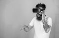 DJ in VR glasses creating new tracks. Man with hipster beard playing with new tech toy. Bearded man rehearsing show in