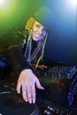 Dj woman playing music by mixer Royalty Free Stock Photo