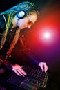 Dj woman playing music by mixer Royalty Free Stock Photo
