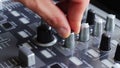 DJ Working with Sound mixing console