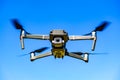 DJI Drone Mavic 2 Pro flying against blue sky Royalty Free Stock Photo