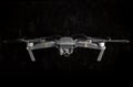 DJI Mavic Pro drone - Flying in the dark, on black background. Closeup on dark. One of the most portable drones in the