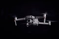 DJI Mavic 2 Pro - Flying in the dark, on black background. Closeup on dark. One of the most portable drones in the