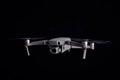 DJI Mavic 2 Pro - Flying in the dark, on black background. Closeup on dark. One of the most portable drones in the