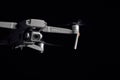 DJI Mavic 2 Pro - Flying in the dark, on black background. Closeup on dark. One of the most portable drones in the