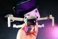 Dji Mini 2 new drone in hand close-up with remote