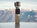 Dji Osmo pocket gimbal. Alps mountain range in the background