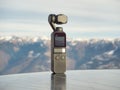 Dji Osmo pocket gimbal. Alps mountain range in the background