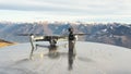 Dji Osmo pocket gimbal and Mavic Pro drone. Alps mountain range in the background