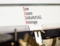 DJIA Dow Jones industrial average symbol. Concept words DJIA Dow Jones industrial average on typewriter on beautiful white