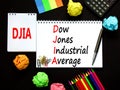 DJIA Dow Jones industrial average symbol. Concept words DJIA Dow Jones industrial average on white note on beautiful black