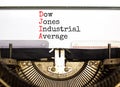 DJIA Dow Jones industrial average symbol. Concept words DJIA Dow Jones industrial average on typewriter on beautiful white