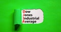 DJIA Dow Jones industrial average symbol. Concept words DJIA Dow Jones industrial average on white paper on beautiful green
