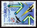 DJIBOUTI - CIRCA 1989: A stamp printed in Djibouti issued for the World Telecommunications Day shows Satellite Dish and receiver