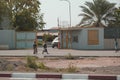 2 Djiboutian women and Djiboutian little girl in local dress walking on the road. Editorial shot in Djibouti Royalty Free Stock Photo