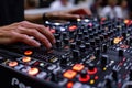 DJs hands mixing on a professional soundboard at a nightclub, bar, or event