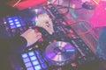 DJs are turntablism turntables plate mixer night party pub Motion blur wite light sunset abstract background.