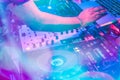 DJs are turntablism turntables plate mixer night party pub Motion blur wite light sunset abstract background.