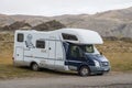 Ford camper parked in rural Icelandic landscape