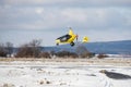 DLOUHA LHOTA CZECH REP - JAN 27 2021. A yellow GyroMotion flies over a snowy runway at the airport in PrÃÂ­bram Czech Republic