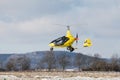 DLOUHA LHOTA CZECH REP - JAN 27 2021. A yellow GyroMotion flies over a snowy runway at the airport in PrÃÂ­bram Czech Republic