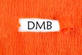 DMB the text under the torn paper is orange on a white background Royalty Free Stock Photo
