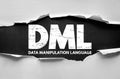 DML Data Manipulation Language term in ripped paper style. Distressed block letters present database programming concept for Royalty Free Stock Photo