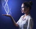 DNA chains flows from hand of young female doctor. Royalty Free Stock Photo