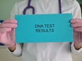 DNA test doctor holds a test tube in laboratory to collect blood samples for DNA analysis Royalty Free Stock Photo