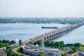 Dnepr, Ukraine - June 07, 2018: new bridge over the Dnieper River. The barge floats in the middle of a wide river. City landscape